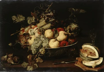 Fruit in a Bowl and a Sliced Melon